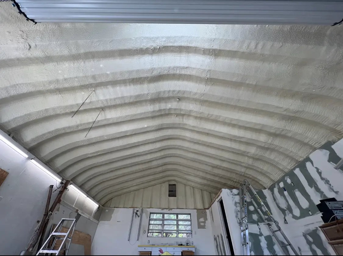 Spray polyurethane foam applied to the underside of a metal roof deck in Cedar Falls